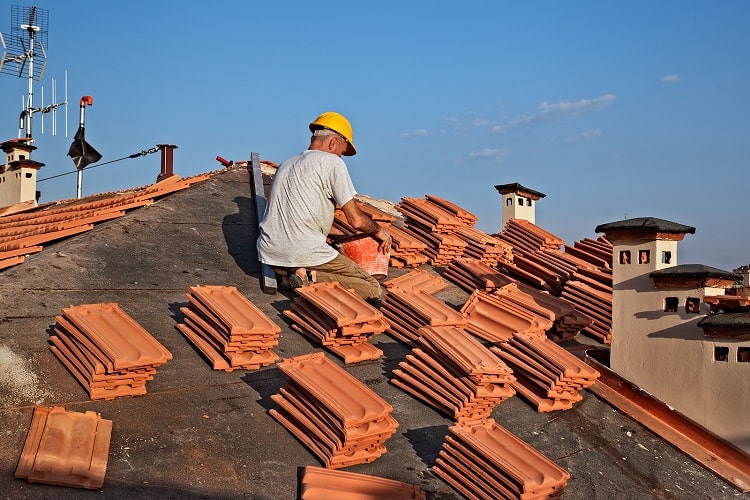 Roofer installing shingles on a home in Lakeland, Florida