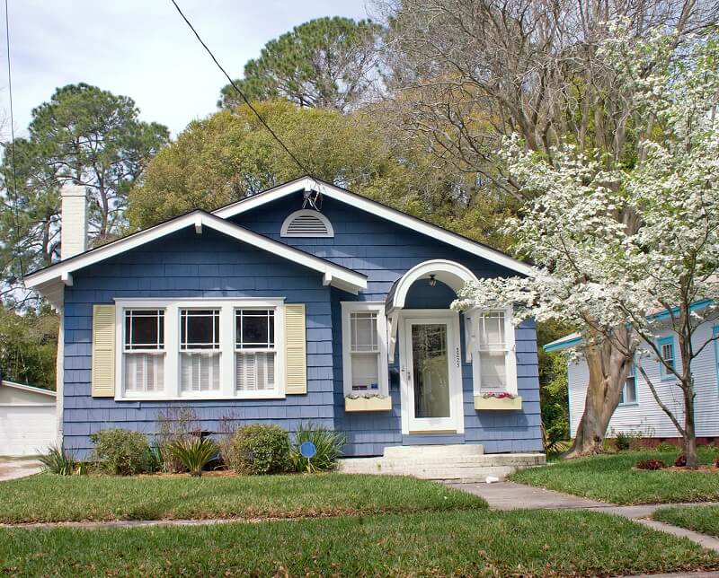 Cottage-style home exterior example for choosing roof colors