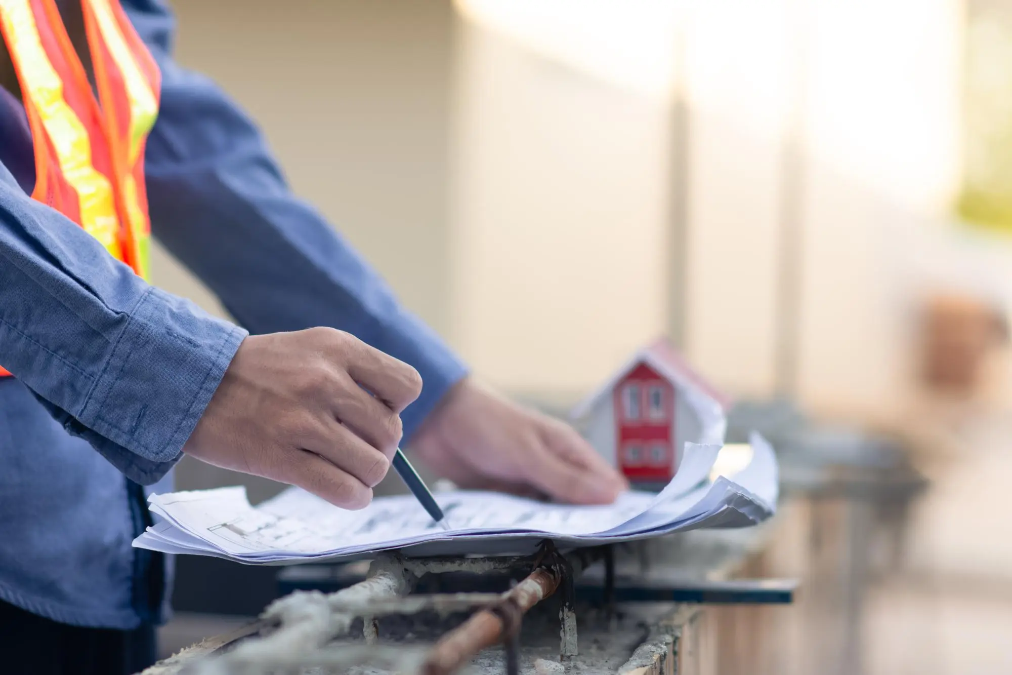 Worker reviewing roofing permit paperwork for a Florida roof replacement