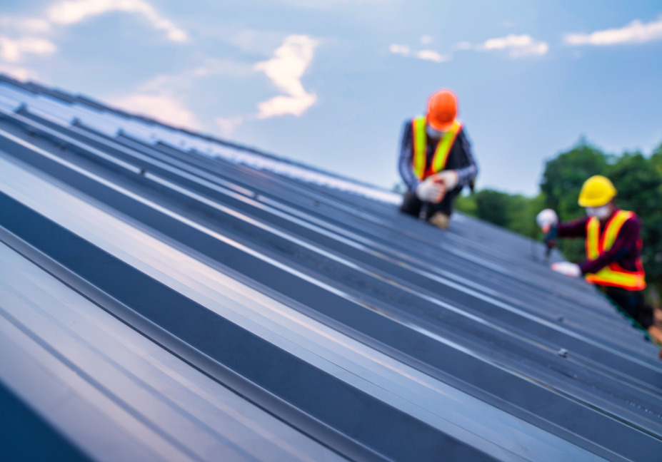 metal roofers repairing roof in Central Florida