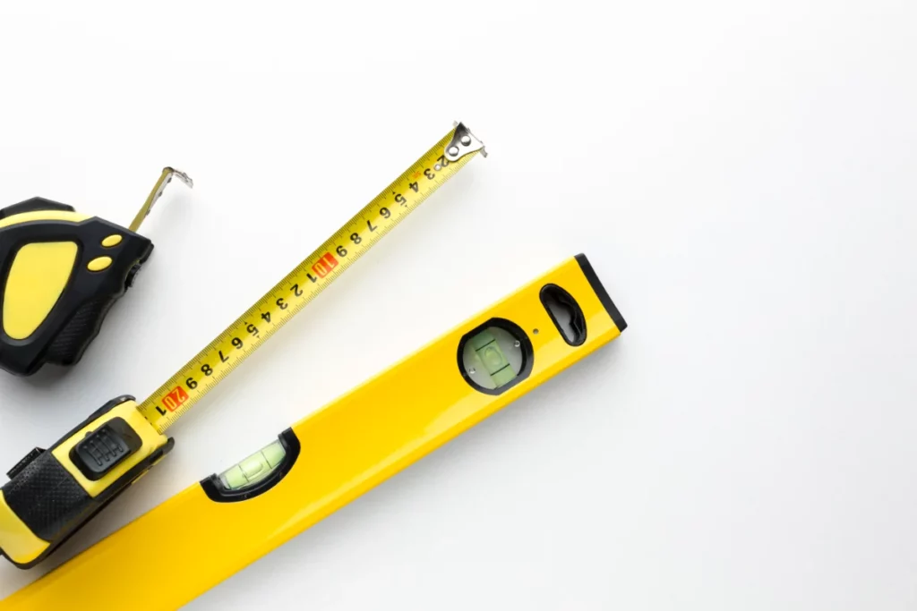 What tools and materials are needed to measure a roof for shingles?