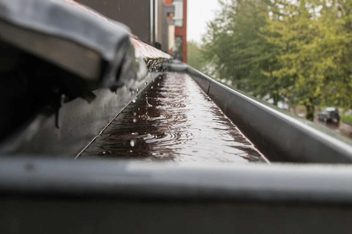 Rain flows down the roof into the drain pipe