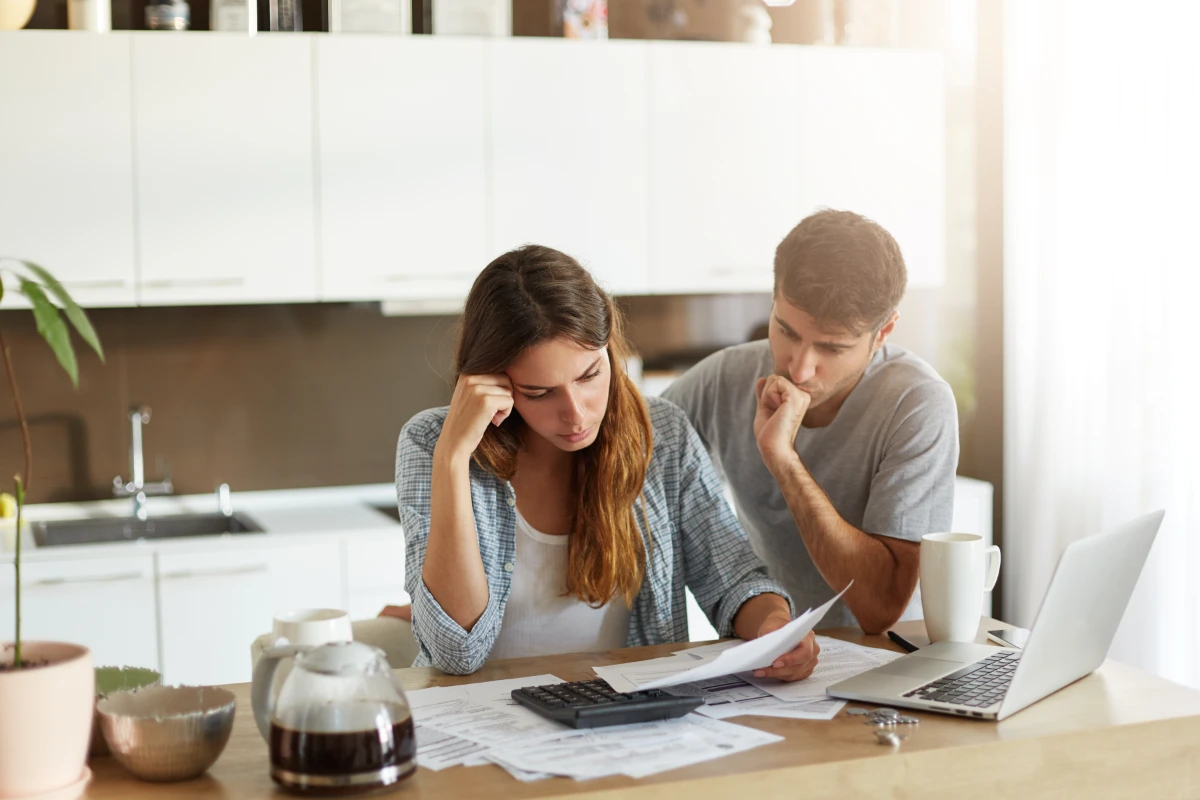 Young couple checking their family budget